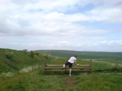 Picture of a competitor climbing a gate.