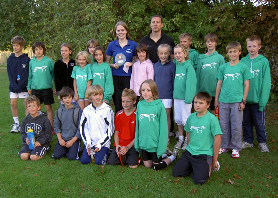 Jo 
				Booker receiving her 2009 England Athletics South East Young Volunteer of the Year award from Scott Grace of England Athletics.