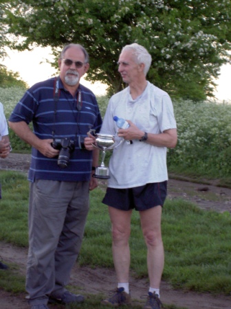 Frank Briscoe receiving the honours from Dick Jégou.